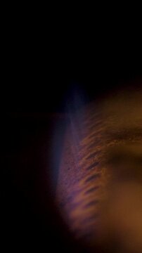Flame in natural gas boiler is a vivid mix of orange and blue colors. It burns with a steady, unwavering intensity, suggesting efficient gas consumption and heat generation