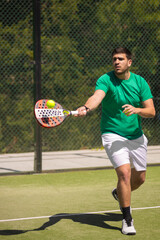 Padel player with racket on court in action at tournament