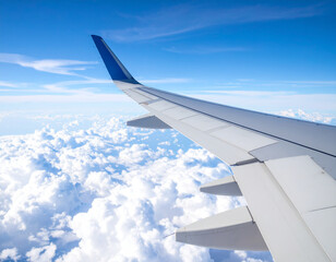 Fototapeta premium Stunning Aerial View Airplane Wing above Cloud Layer