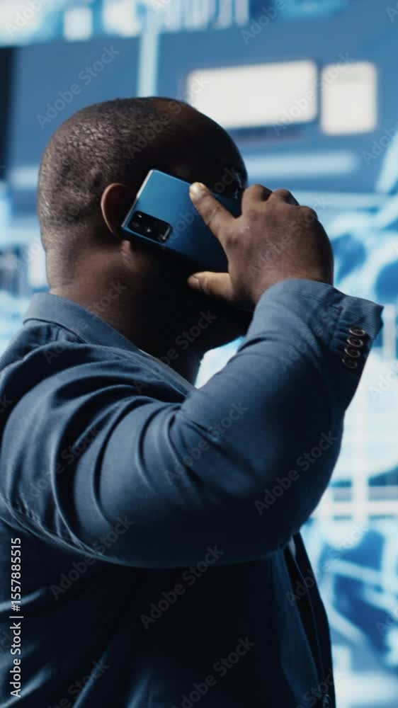 Poster vertical video african american it expert answers phone call to discuss deep learning through neural