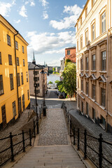 Charming cobblestone street descending to Stockholm waterfront