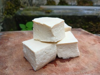 Fresh Tofu Cubes on Wooden Board
