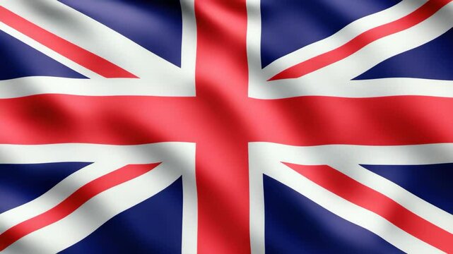 Red white and blue Union Jack waving in the wind. Symbol of national pride.