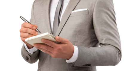 Businessman writing notes in a notebook, professional attire, isolated on white background.