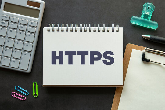 There is notebook with the word HTTPS. It is an abbreviation for Hypertext Transfer Protocol Secure as eye-catching image.