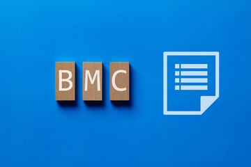 There is wood block with the word BMC. It is an abbreviation for Business Model Canvas as eye-catching image.