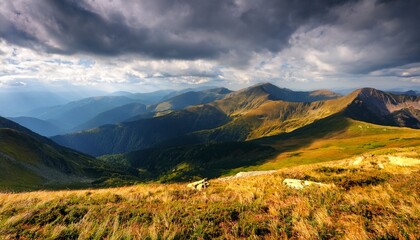 summer landscape with mountain range in cold weather carpathian watershed ridge and wonderful alps in the distance alpine scenery under cloudy sky in dappled light