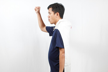 Asian man excited wearing red and white flag on his body facing sideways raising his hand while...