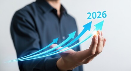 Man's Hand Holding Upward Arrows With 2026 Displaying Growth And Future Progress