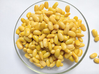 Edamame or soybean on glass bowl isolated white background. Edamame is superfood for healthy and diet. 