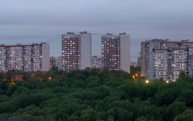 Multi-storey buildings of standard panel residential buildings near the forest