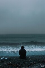 Fototapeta premium The lonely figure by the sea