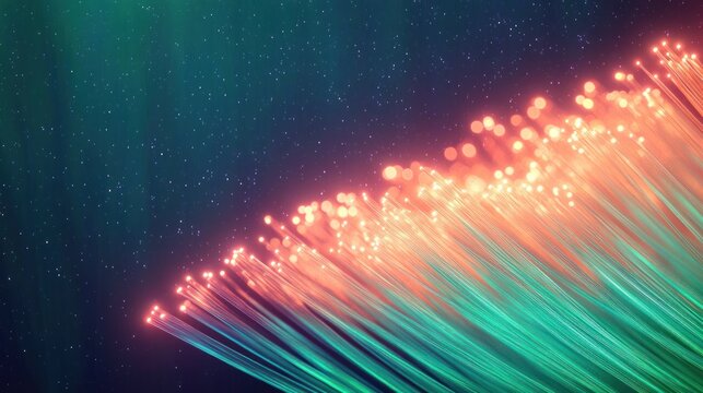 Close-up of glowing fiber optic cables emitting green and orange light against a dark blue background creating a futuristic and vibrant atmosphere