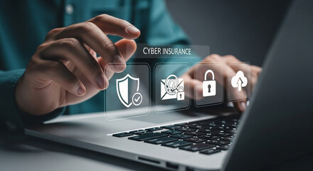 Man typing on laptop with cyber insurance icons displayed above the keyboard in a digital overlay