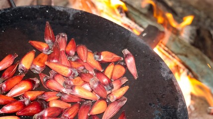 
Pine nuts being roasted on the fire