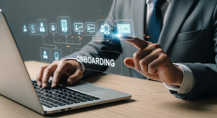 A person in a suit using a laptop with an onboarding graphic overlay and touching the screen