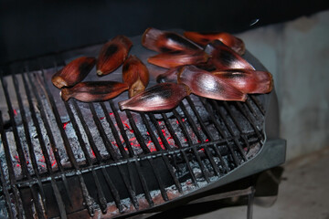 Araucaria pine nut roasted in a rustic way on a hot surface in the fire