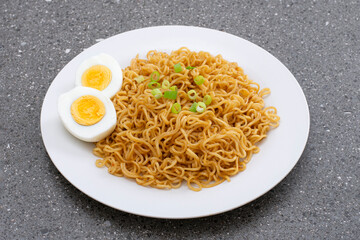 Fried instant noodles with boiled eggs