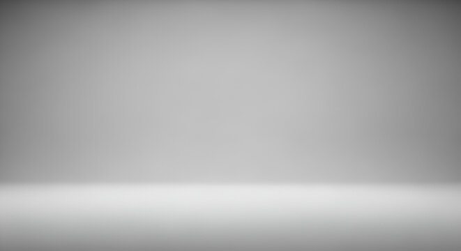 Empty gray studio room background with a smooth gradient for product display. Abstract minimalist backdrop with a clean, modern look.