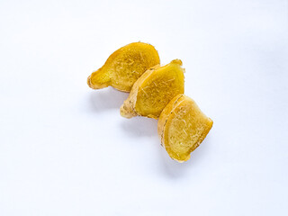 Fresh ginger rhizome sliced isolated on white background