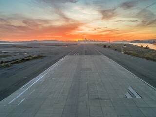 Sunrise over San Francisco, California, USA, viewed from Alameda Naval Air Station. The sun rises...