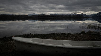 Gloom of Solitude, A Boat by the Still Lake