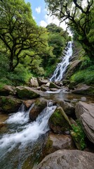 Fototapeta premium A waterfall cascading down rugged rocks in the tropical forest