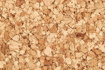 Close up of a textured cork board, showcasing a natural and organic pattern