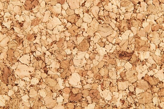 Close up of a textured cork board, showcasing a natural and organic pattern