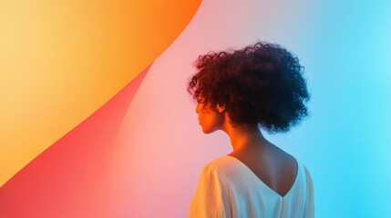 Woman with curly hair, profile view, colorful background