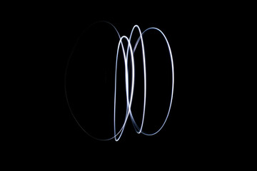 Abstract Light Trails on Black Background Creating Unique Shapes