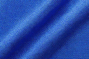 Blue fabric texture, showing the subtle folds and texture of the material. The color is a rich, deep blue, almost cobalt.