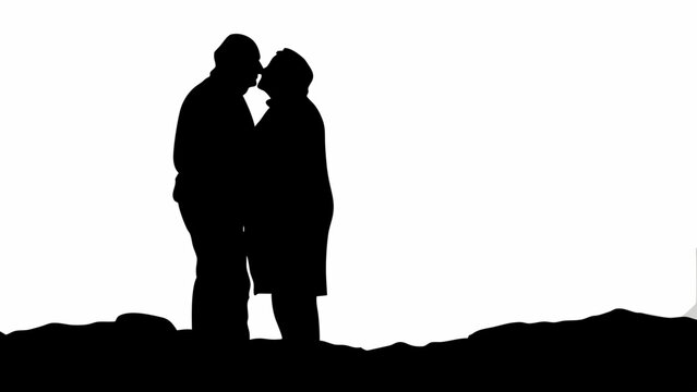Silhouette of an elderly couple embracing affectionately against a bright white background landscape view - Powered by Adobe