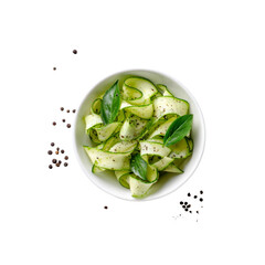 Obraz premium Delicious Zucchini Noodles with Basil and Peppercorns in a White Bowl