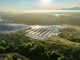 Photovoltaic panels on a hillside at sunrise