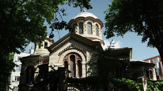 Beautiful Eastern Orthodox church in Chișinău, Moldova, featuring classic domes, detailed facades, and rich architectural heritage. Captured on a clear, sunny day.