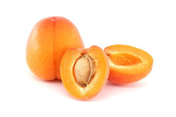 Fresh Ripe Apricots Whole and Sliced on a White Background