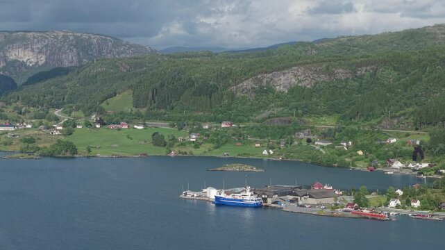 Mountain Scenery With Coastal Villages Near Industrial Harbor In Vestland, Norway. Aerial Shot
