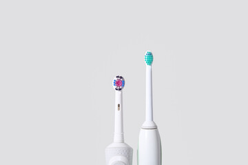 Electric toothbrushes on white background.