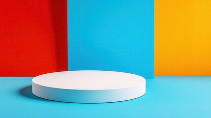 White Cylindrical Platform on Vibrant Red Blue Orange Background