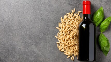 Red Wine Bottle with Pasta and Basil on Gray Background