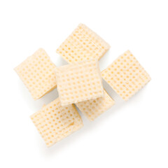 Tasty feta cheese pieces on white background