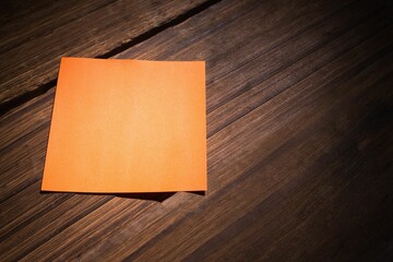 Orange paper on wooden floor