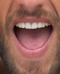 Adult male face is showing flat design close-up with lips, teeth, tongue, moustache, stubble