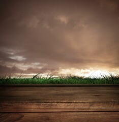 Wooden planks against cloudy sky