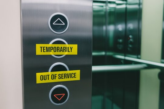 malfunction elevator with out of service tape on button