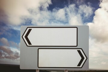 Composite image of sign posts against sky