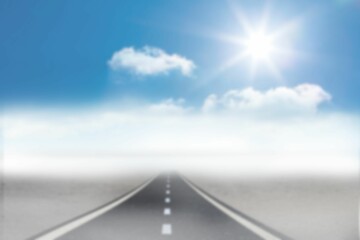 Empty road towards sky in foggy weather