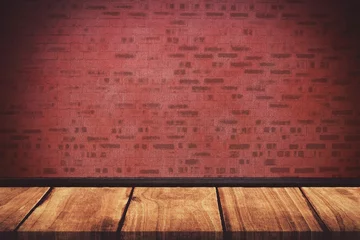 Wall murals Light falling on red brick wall against floorboard