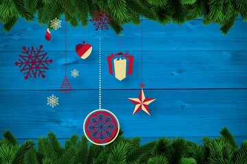 Christmas baubles in front of wood